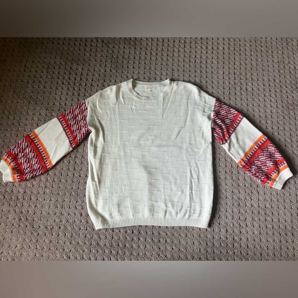 Roolee XS cream sweater with detailed red/orange sleeves